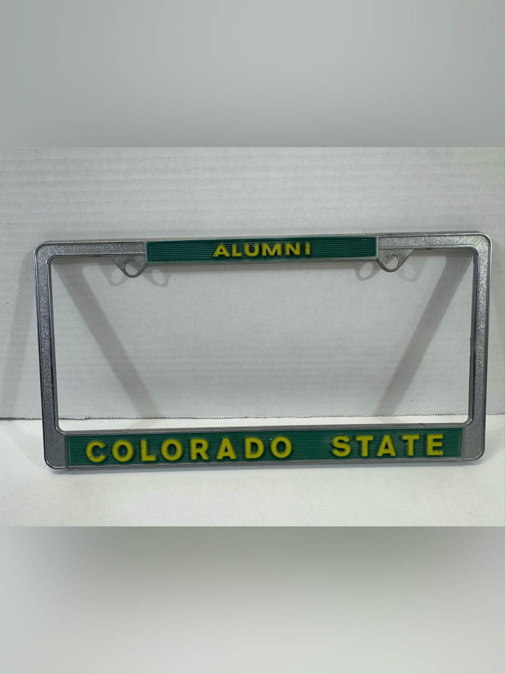 Green and Yellow 'ALUMNI' COLORADO state license plate frame border metal